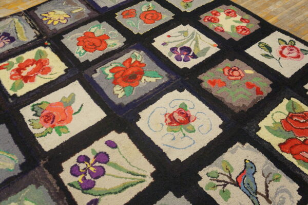 A thick, multicolored floral hooked rug featuring a diamond grid pattern resting on light wood floors.
