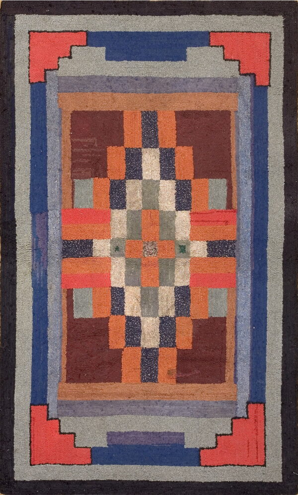Multicolored high pile rug with a checkerboard center framed by stepped borders in varying hues of blue, grey, and coral.