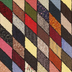 Textured, high-pile rug with a vibrant diagonal lozenge pattern using many solid and speckled colors.