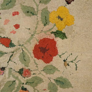 Floral design on ivory wool rug.