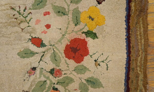 Floral design on ivory wool rug.