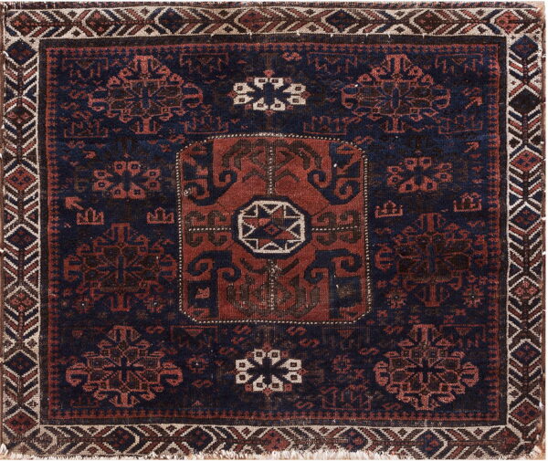 Square rug with a dark blue field, terracotta and black traditional motifs, and a geometric border.