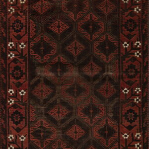 Rectangular dark brown and rust red rug with repeating geometric motifs and white accent details in the border.