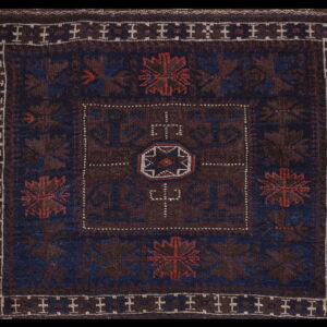 Intricate patterns on dark wool rug
