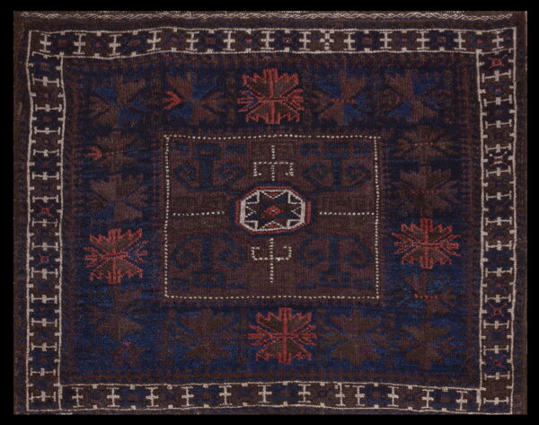 Intricate patterns on dark wool rug