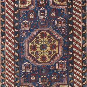 Deep blue rug featuring geometric tribal patterns, a gold central medallion, and striped outer borders.