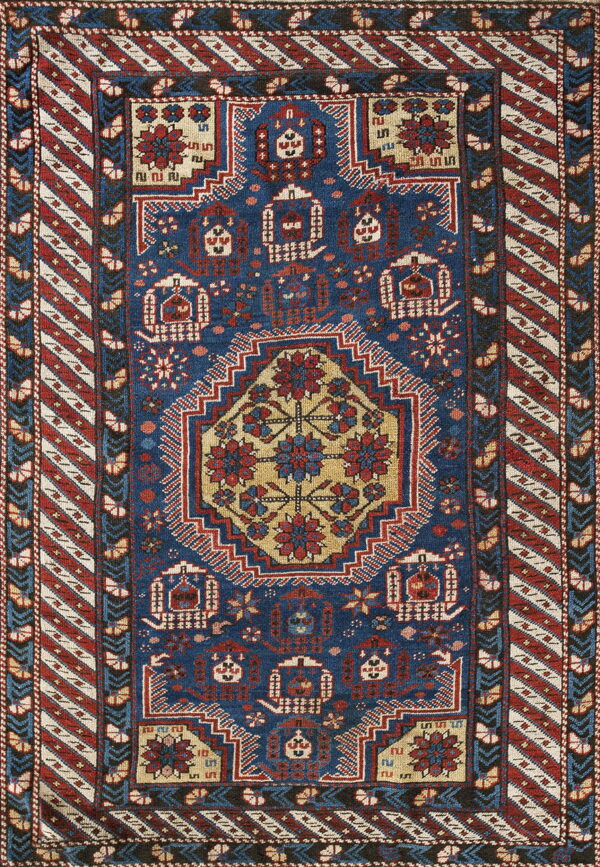 Deep blue rug featuring geometric tribal patterns, a gold central medallion, and striped outer borders.