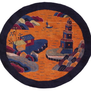 Circular navy-bordered rug displaying an orange water scene with a pagoda, boat, and colorful stylized cliffs.