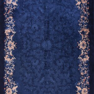 Deep navy blue rug with a carved floral field and a wide border of blush pink and dark blue blooms.