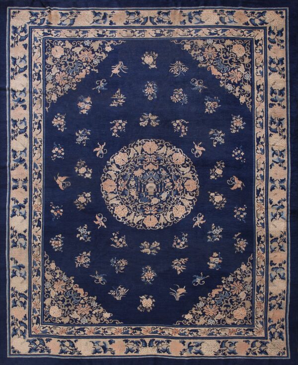 Wool hand knotted pile blue antique rectangle 1890s rug 1 Rectangular dark blue rug with intricate pale pink and blue floral patterns and wide decorative borders.