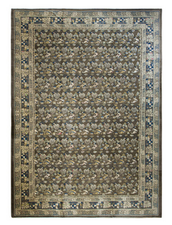 Traditional rug with a dark brown field patterned with repeating cream, blue, and tan stylized floral and animal designs.