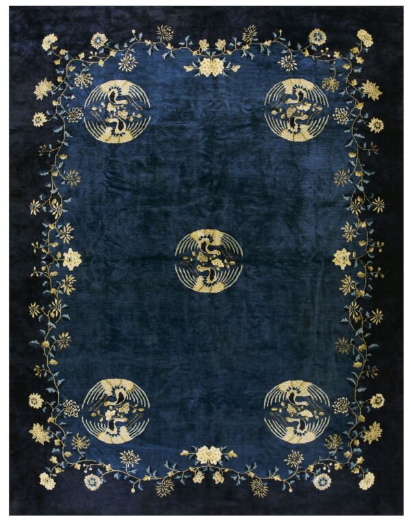 A dark blue rug featuring five golden circular bird motifs framed by an elaborate floral vine border.