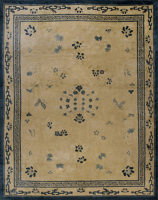 A low pile rug featuring a gold field, scattered blue floral sprays, and a dark blue geometric border.