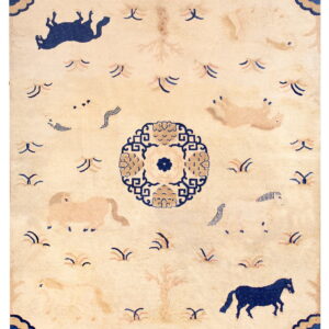 Beige field rug with blue and tan horse motifs, a geometric medallion, and striped borders.