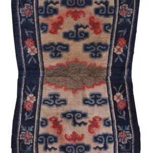 Contoured rug featuring a beige field with red and blue Chinese cloud patterns and a navy floral border.