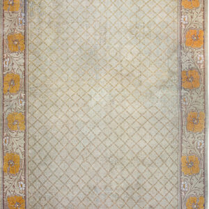 Light green rug featuring a subtle trellis pattern field and bold borders with large orange flowers.