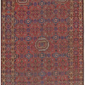 Red runner rug with an all-over navy blue and cream geometric pattern and wide decorative border.