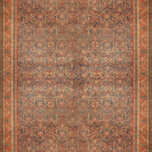 Traditional rug featuring a dense floral pattern on a navy blue field with wide rust orange borders.