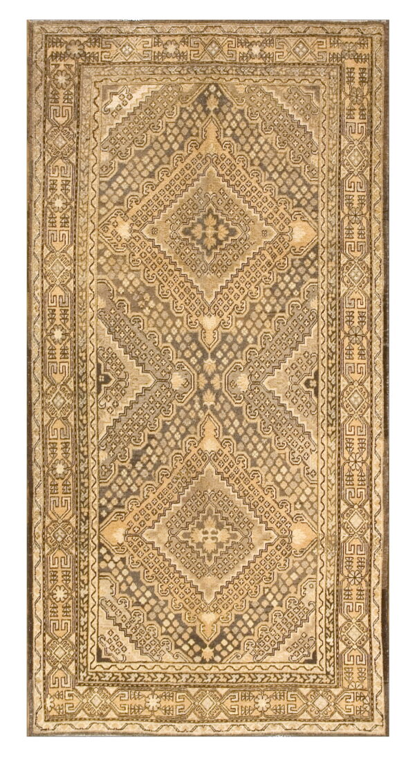 Traditional rug featuring a large geometric diamond medallion in tan, brown, and grayish-khaki tones.