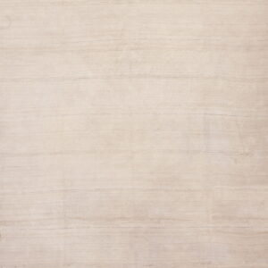 Full view of a flatwoven rug in a natural beige color with subtle horizontal stitched seams.
