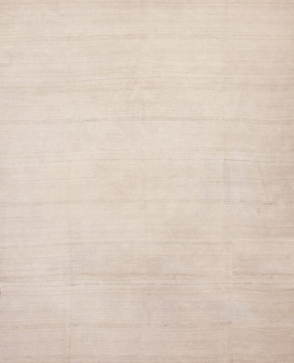 Full view of a flatwoven rug in a natural beige color with subtle horizontal stitched seams.