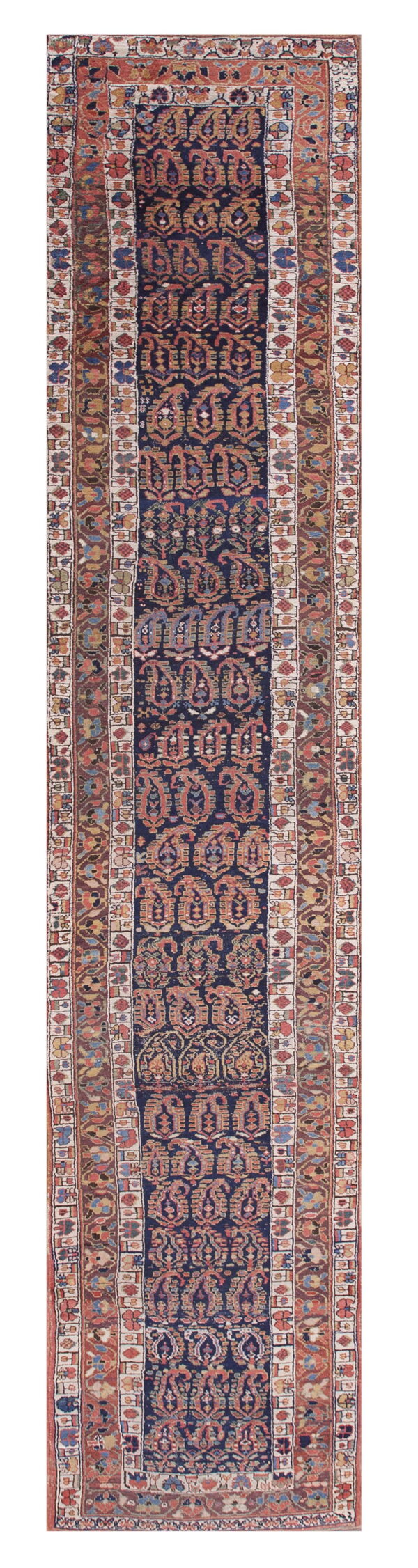 Low-pile navy blue runner with repeating rust and gold traditional paisley motifs and complex borders.