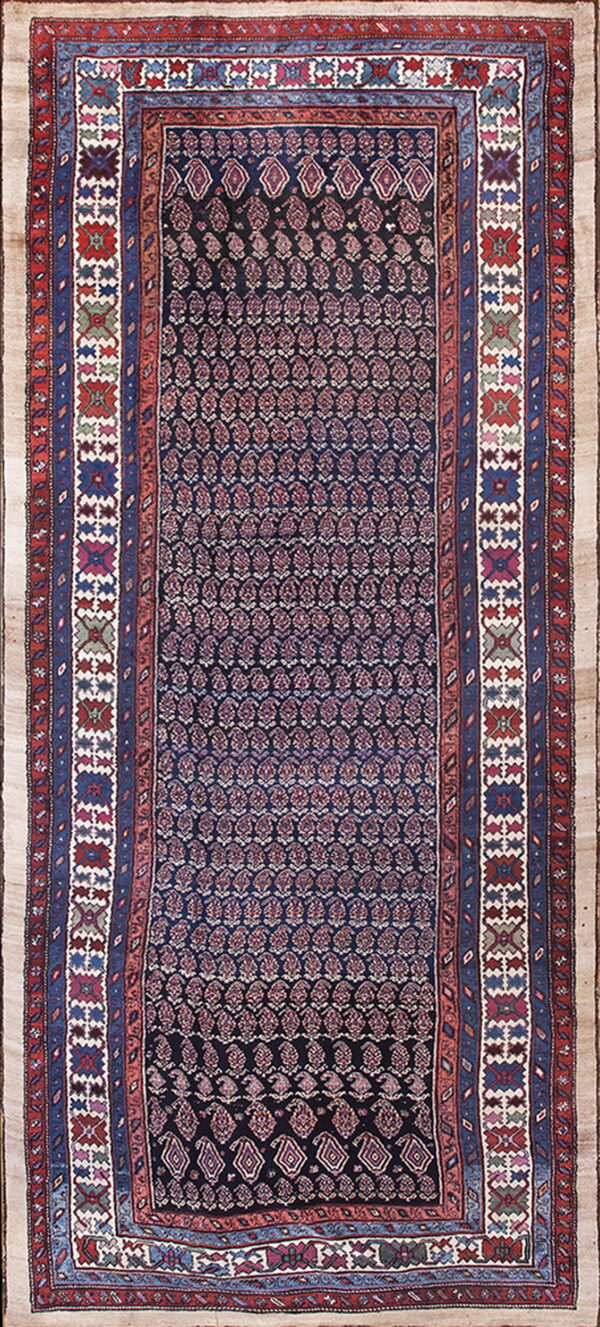 Dark blue runner rug with repeating stylized motifs and intricate multi-colored borders in red, blue, and white.