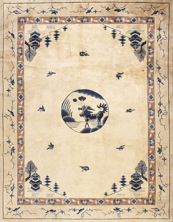 Light beige rug with a blue mythical creature medallion and brown and blue scenic borders.