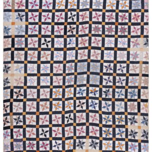 A patchwork textile featuring multicolored star quilt blocks set in a grid of dark navy and orange squares.