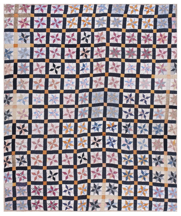 A patchwork textile featuring multicolored star quilt blocks set in a grid of dark navy and orange squares.