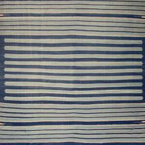 Blue striped rug with subtle patterns.