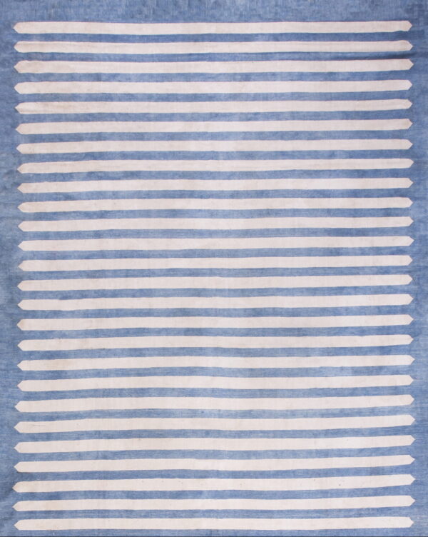 Low pile rug featuring wide horizontal blue and cream stripes with arrowhead edges.