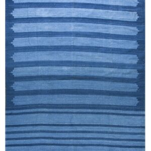 Blue striped flatweave rug featuring staggered edges and a thick white striped border along the bottom.