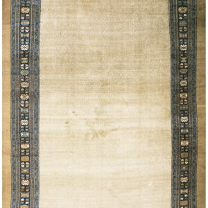Beige runner rug with a subtle low-pile geometric field and an elaborate navy multicolored floral border.