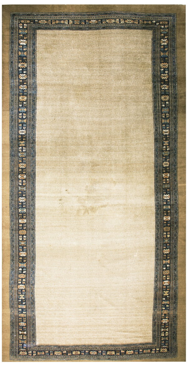 Beige runner rug with a subtle low-pile geometric field and an elaborate navy multicolored floral border.
