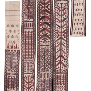 Four flatweave textiles with geometric and stylized tree motifs in cream, red, and indigo colors.