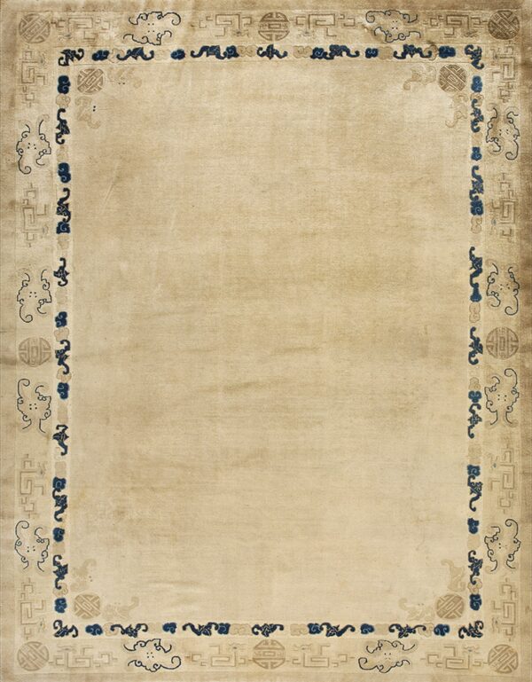 Low pile beige rug featuring a detailed border of blue cloud motifs and tan geometric patterns.