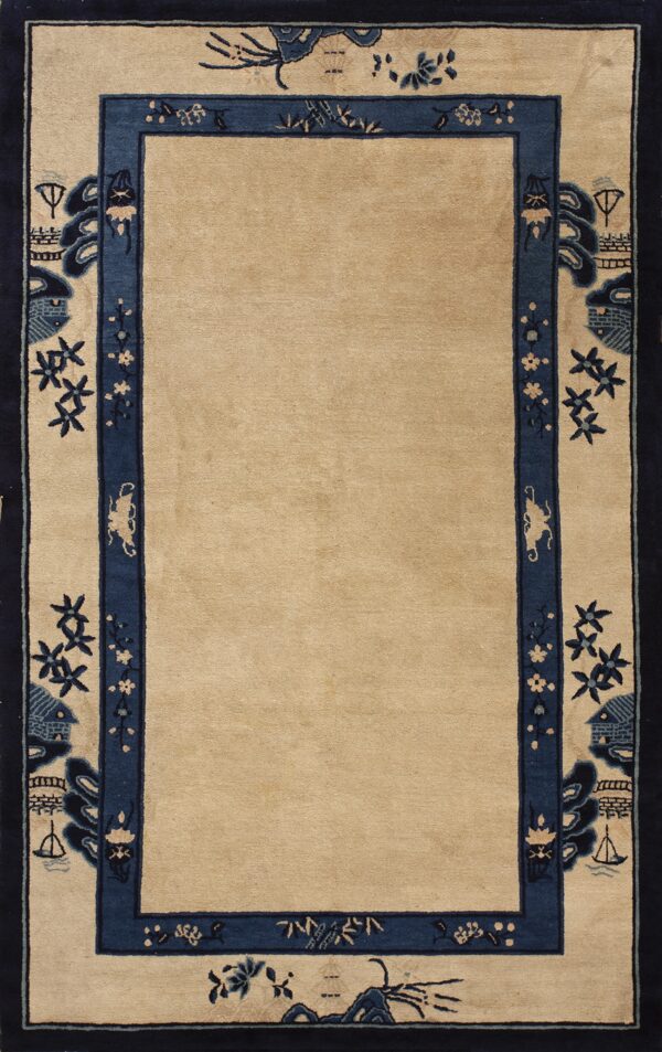 Tan rug featuring a stylized navy blue border with low-relief designs of ships, pagodas, and flowers.