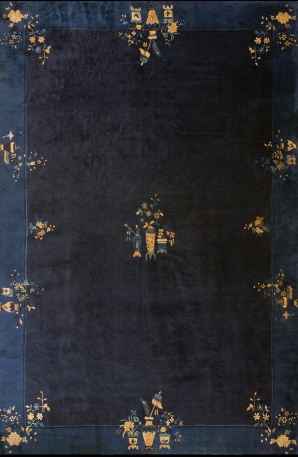 Navy rug with floral motifs.