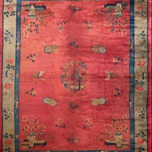 Coral rug with floral Chinese motifs.