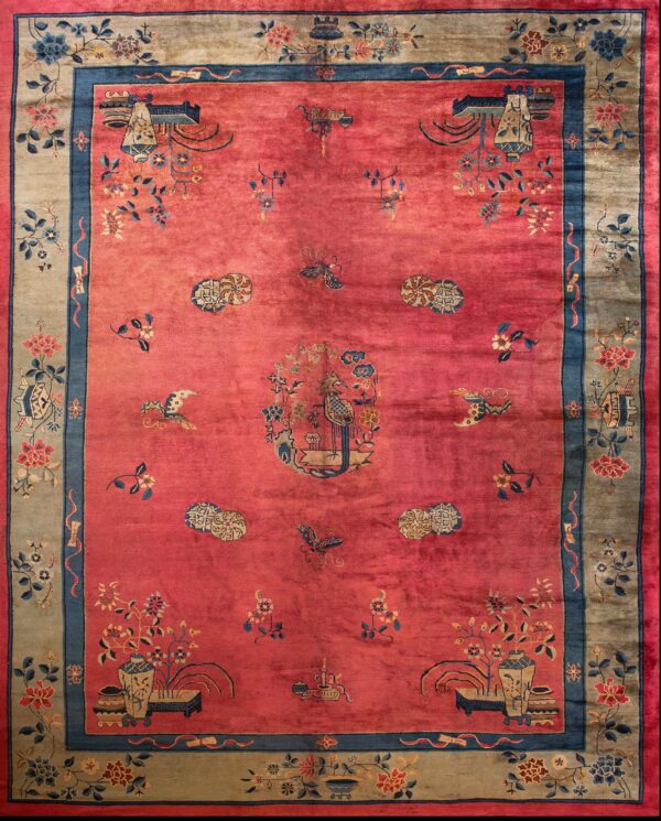 Coral rug with floral chinese motifs.