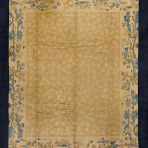 Beige rug with subtle floral design, wide landscape border in blue and tan, framed by a solid dark blue edge.