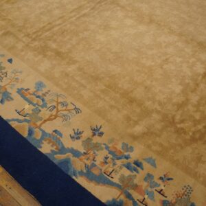 Gold-toned rug with a subtle field pattern and wide border featuring blue and peach landscapes.
