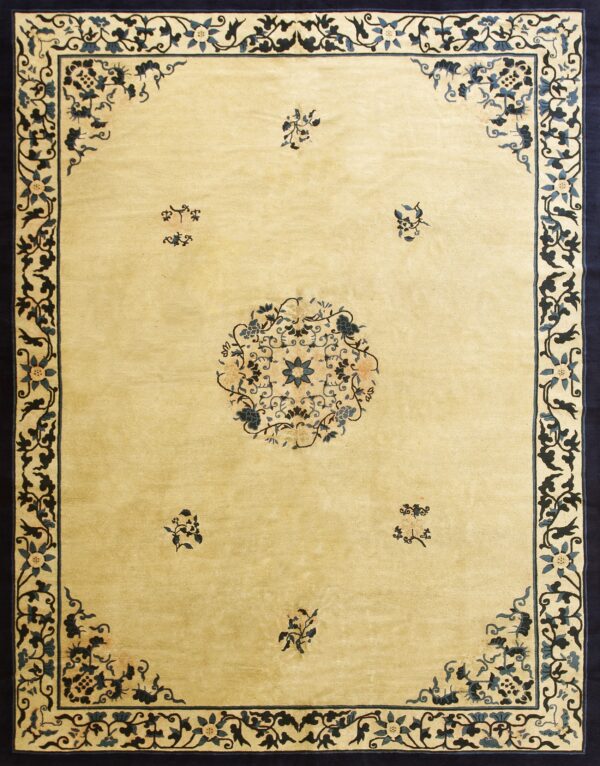 Pale yellow rug featuring a wide navy border with blue floral scrollwork and a matching central medallion.