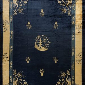 Dark blue velvety rug with gold motifs featuring a central pagoda and wide beige floral border.