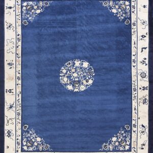 A rich blue rug with cream borders, featuring traditional floral corner sprays and symbols.