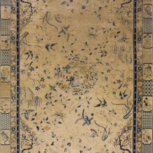 Tan rug with scattered dark blue flora, fauna, and a central pavilion motif, surrounded by patterned borders.