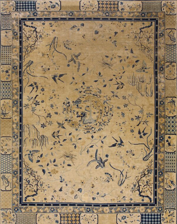 Tan rug with scattered dark blue flora, fauna, and a central pavilion motif, surrounded by patterned borders.