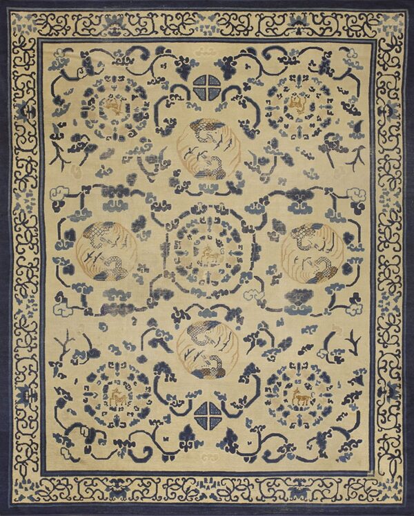 Ivory rug with sprawling blue motifs, central medallions featuring birds, and a thick dark blue border.