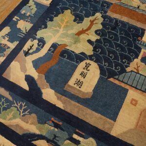 Medium-pile rug with blue and beige scenic design featuring buildings, water, and trees on wood flooring.